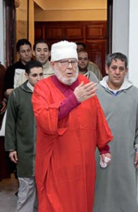 in red with students